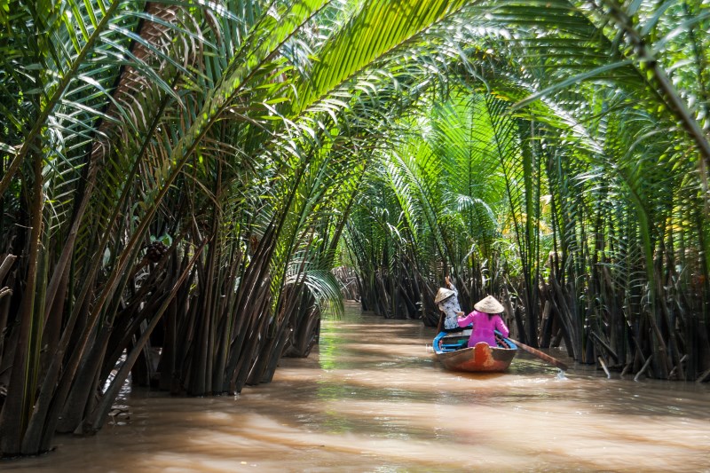 Padding through the canal in Mekong River