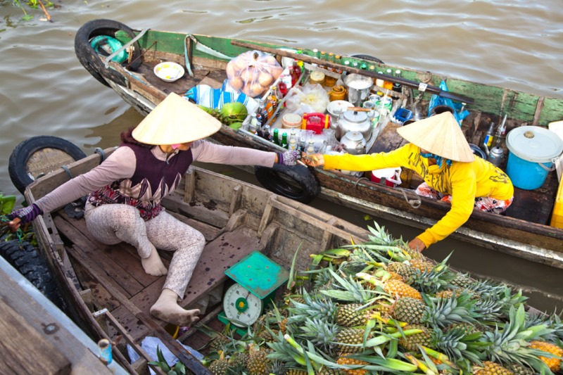Trading on boat at Cai Be Floating Market